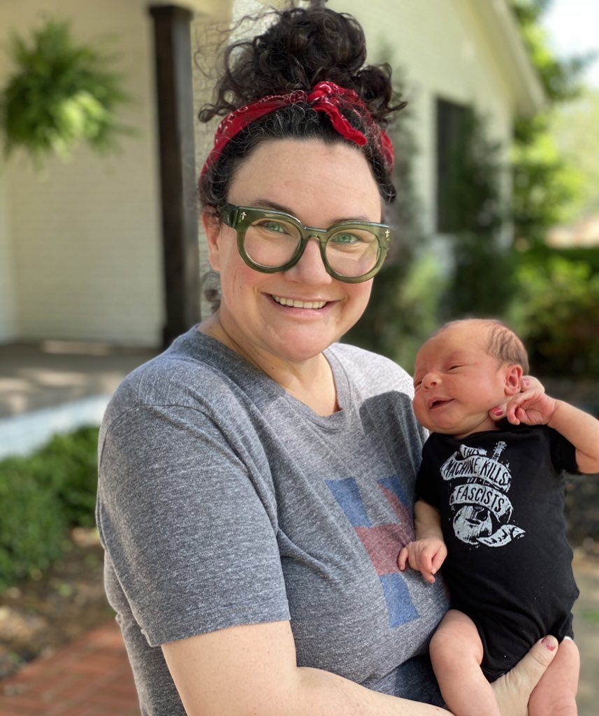 We went on a walk today repping our favorite nonprofit in Tulsa! @WoodyGuthrieCtr #thismachinekillsfascists #thisbabywillchangetheworld #futurefolksinger #futureactivist #proudmama #proudboardmember