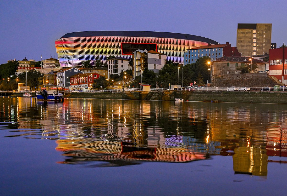Millar_Colin's tweet photo. Athletic Club Bilbao's beautiful San Mamés beside the river Nervión lit up on the International Day against LGBTIQphobia 🌈🌈 https://t.co/ZNnIaAt0GW