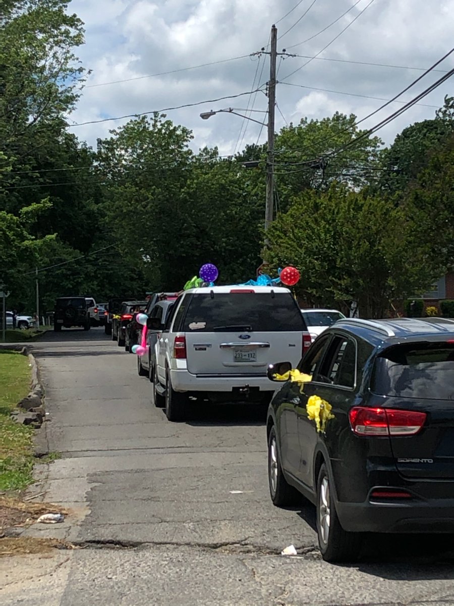 Taylor faculty and staff celebrate Mrs. Hughes' soon arriving baby girl with a drive by diaper parade on Friday afternoon.