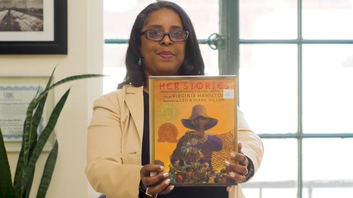 Librarian holding a book