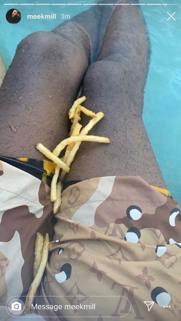 meek mill instagram story in swimming pool with french fries on his lap