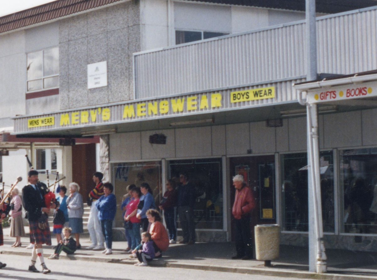 Still more Main St, Otautau photodocumentary, pre & post Covid street scenes: 1. Started as small wooden shop next to original butchers, used over years by many local shops, CC 0; Burned down & rebuilt; 2. Merv's Menswear during 80s-90s CC BY; 3 & 4. Then & still Takeaways. CC BY