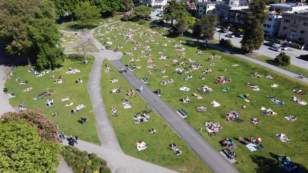 Kits beach on Monday May 18th (long weekend) around 4:30pm, after a cloudy/rainy weekend. Temp approx 18 deg Celsius. The grass area is busier that the beach. Most groups are social distancing with a few exceptions. – at  Kitsilano Beach