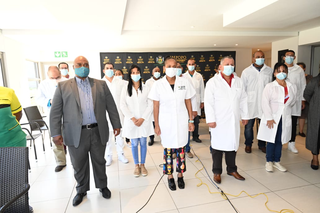 OtpLimpopo's tweet photo. Group photo of the MEC Dr Phophi Ramathuba with Cuban Brigade at St Maria Boutique, Polokwane. Pic by Elvis Tshikhudo. #COVID19 #CoronavirusInSA #StayAtHome #LockdownSA https://t.co/UrHdA6equB