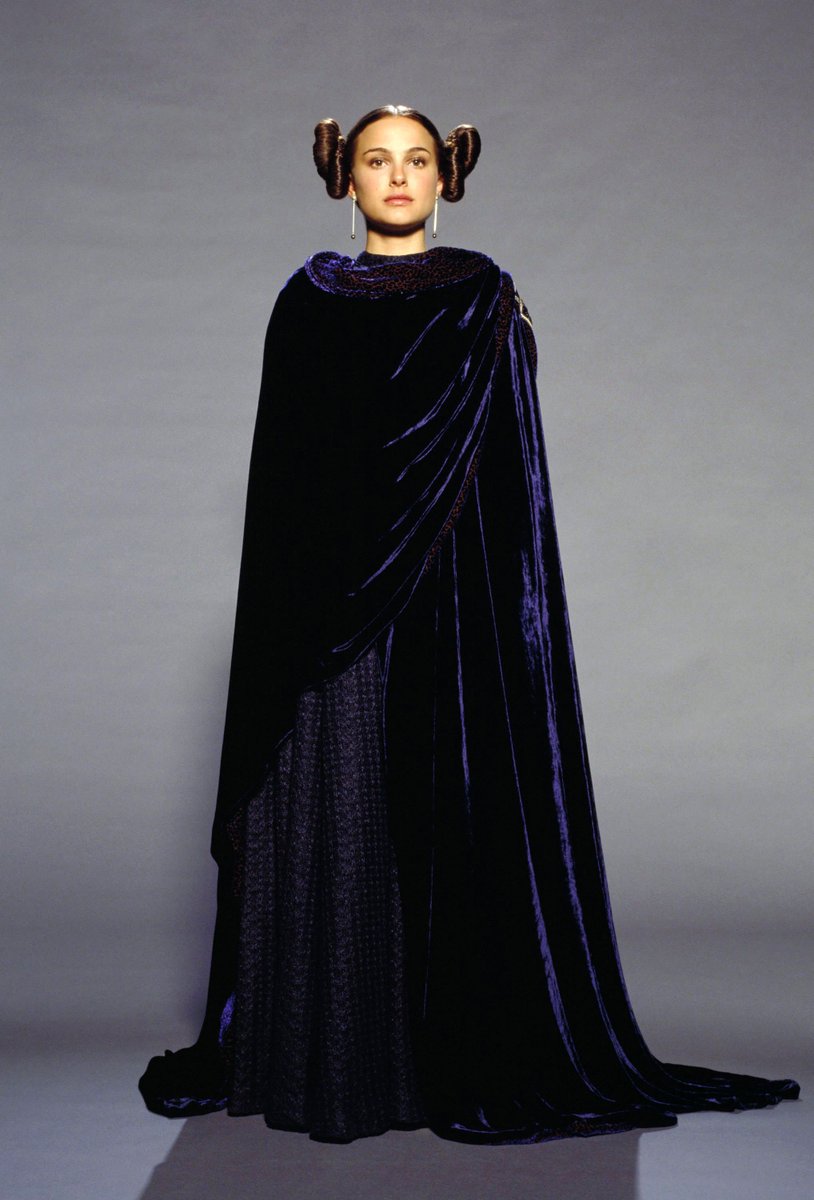32. "leia buns" cloakwe love a good velvet cloak, i just wish this one had a bit more contrast to its fabrics. some pretty beading on the shoulders and i love the hair, plus it covers up that linen dress so win-win.