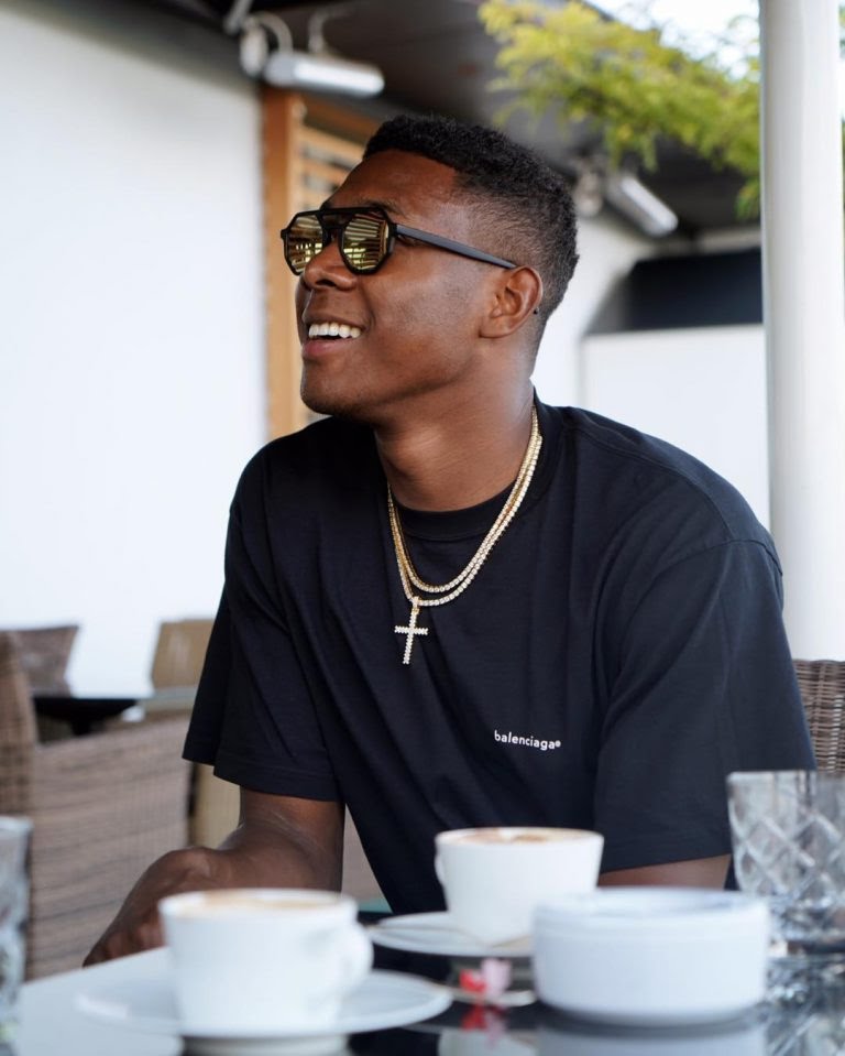 10. David AlabaDavid Alaba is a left back who plies his trade at Bayern Munich, he's an Austrian with Nigerian roots.Man knows his stuff and he struts it with ease, his shades and hair game are really tight.Very humble with a quiet demeanor, loves black passionately.