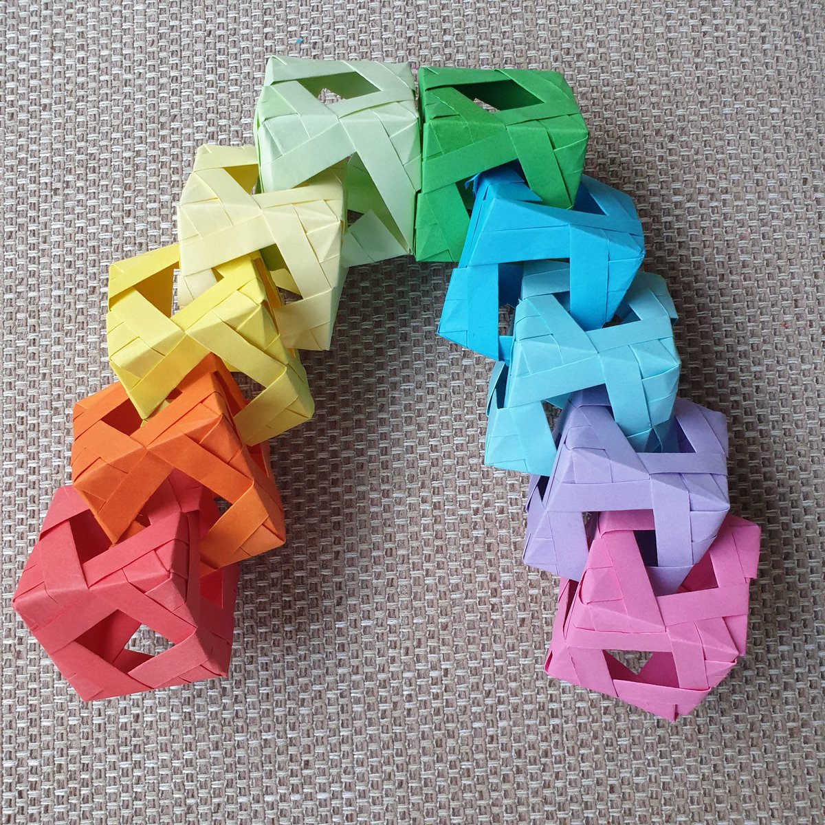 AmyJCast's tweet photo. Thanks for inspiring me @anniek_p. Today's #mathartchallenge. This has really stretched my skills - particularly linking them together.  Extremely satisfying process as it came together. Enjoyed sitting in the sunshine while I folded. ☀️🌈 #britishorigami #lockdownlearning https://t.co/eAp0vBbA5N