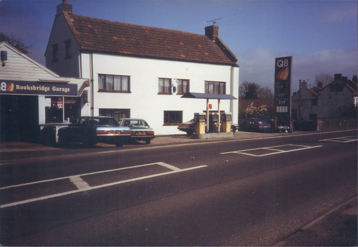 Day 149 of  #petrolstationsQ8, Rooksbridge Garage, Somerset 1993  https://www.flickr.com/photos/danlockton/16078333097/An early 80s Honda Accord(?) joins the XJS and Fords. Before the M5's impact hit, the A38 from Bristol to Taunton had a lot of small garages and transport cafés—almost a British Route 66.