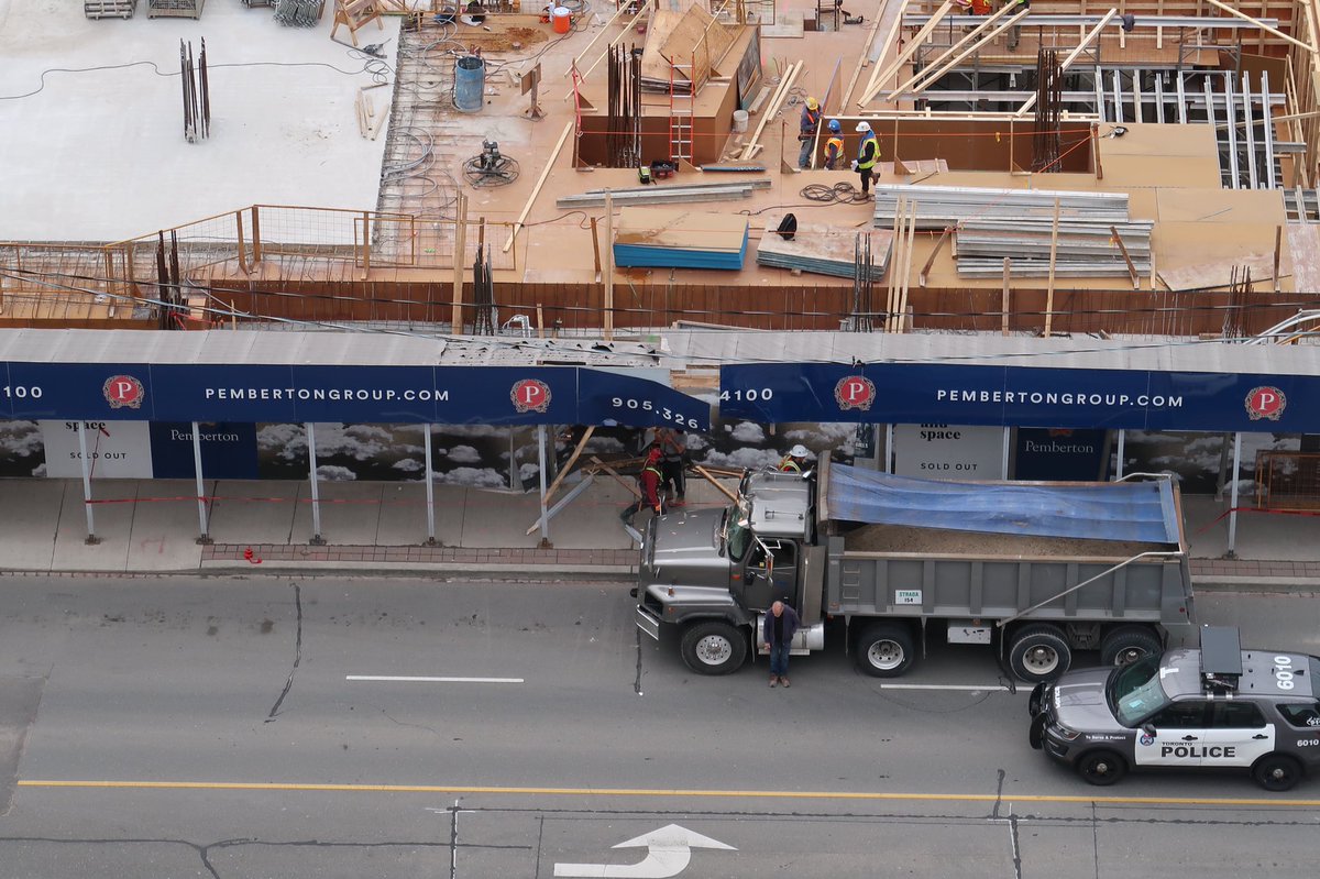 EVanDyk's tweet image. A truck seems to have driven across the sidewalk and through a construction hoarding at Front and Sherbourne. Guess it should have worn high viz clothing? cc @moore_oliver