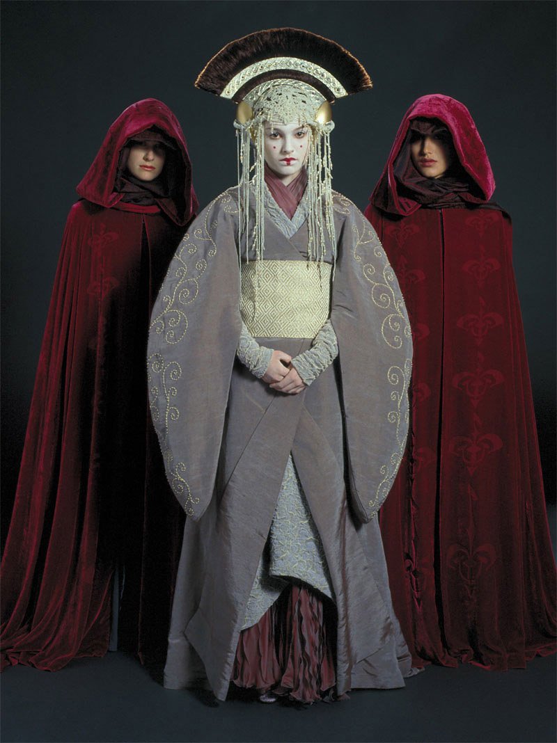 15. pre-senate (tpm)padme may have just barely escaped her planet but she's still dressed to kill. not my favorite of her queen outfits, but still a good one. i'm a fan of the cream/grey/dusty rose color scheme and the dramatic headpiece.