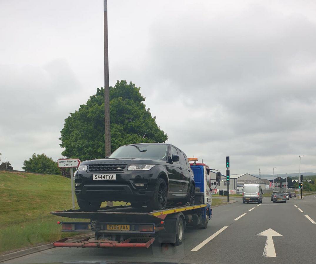 Cars being lifted for forensic investigation.