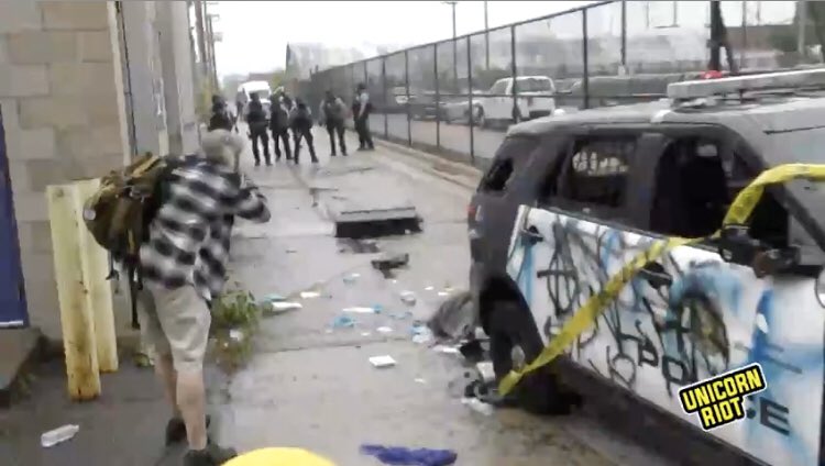 Battle scenes outside the third precinct in Minneapolis as crowds protesting the murder of  #GeorgeFloyd defend themselves against armed riot police firing tear gas canisters