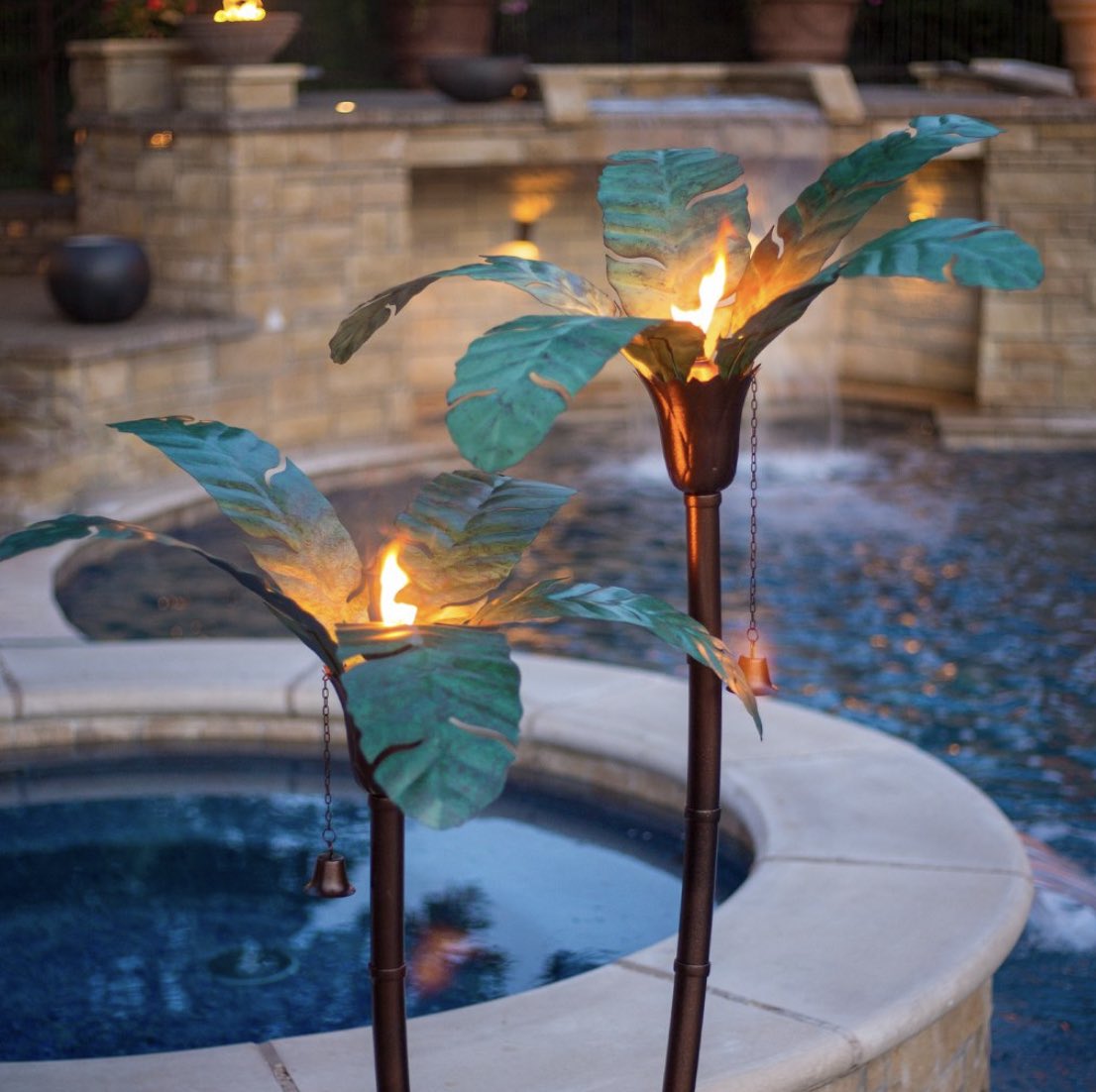 Outdoor lighting is necessary for late night relaxing. 1. Verdigris Palm Torches2. Tiki Hut String Lights3. Solar Flower Bulbs4. Crystal Mason Jar Chandelier