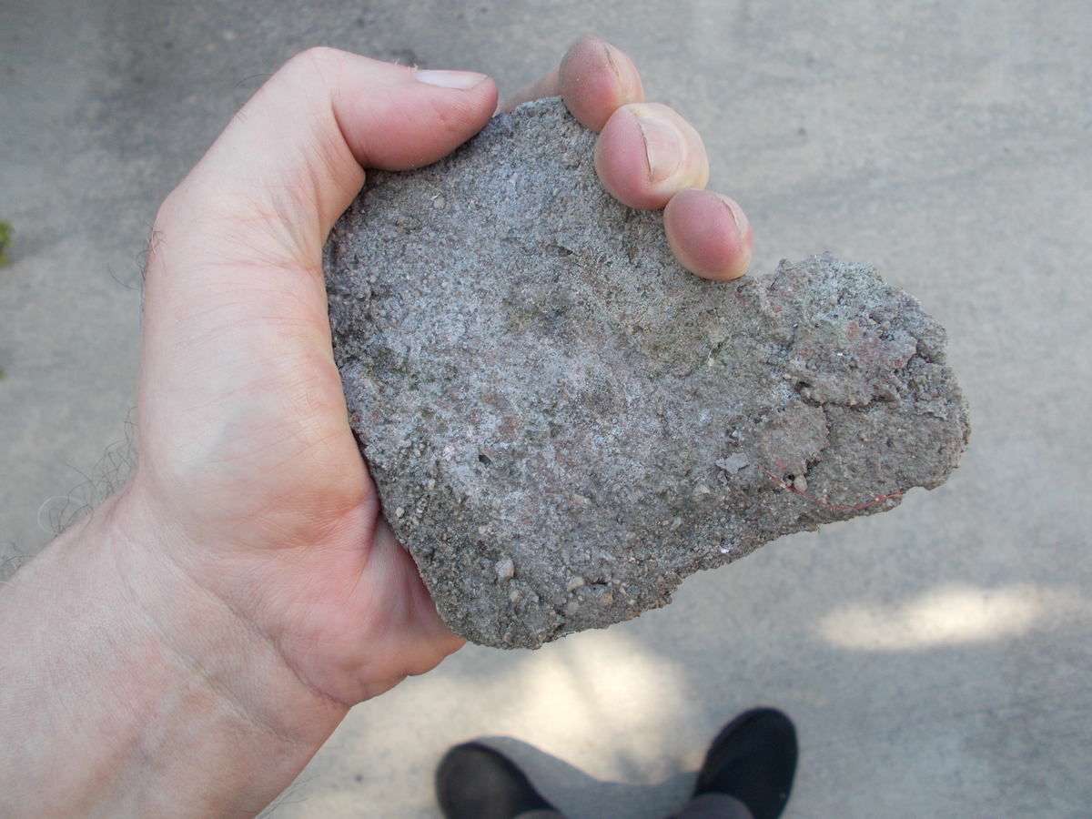 This is a piece of concrete from 1913.I have them all over my yard.For decoration, of course.