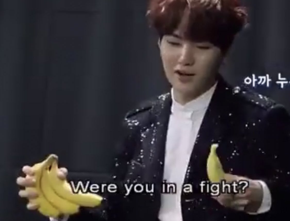 just holding bananas in a sparkly suit