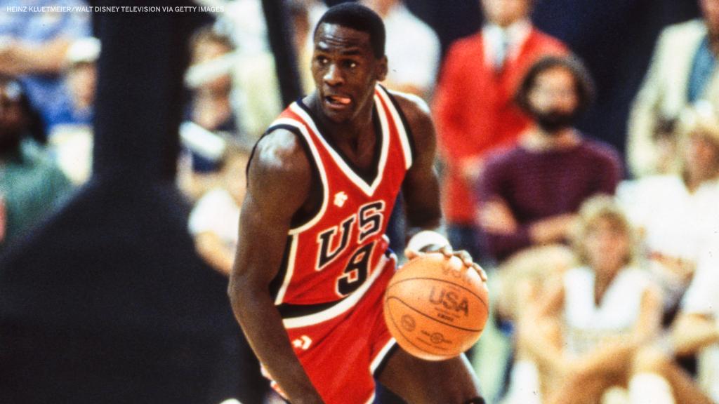 espn's tweet photo. 21-year-old Michael Jordan winning his first gold medal 🥇

In 1984, before MJ had even played an NBA game, legendary coach Bob Knight called him “the best basketball player that I’ve ever seen play.” https://t.co/Y5jlLMEjDl