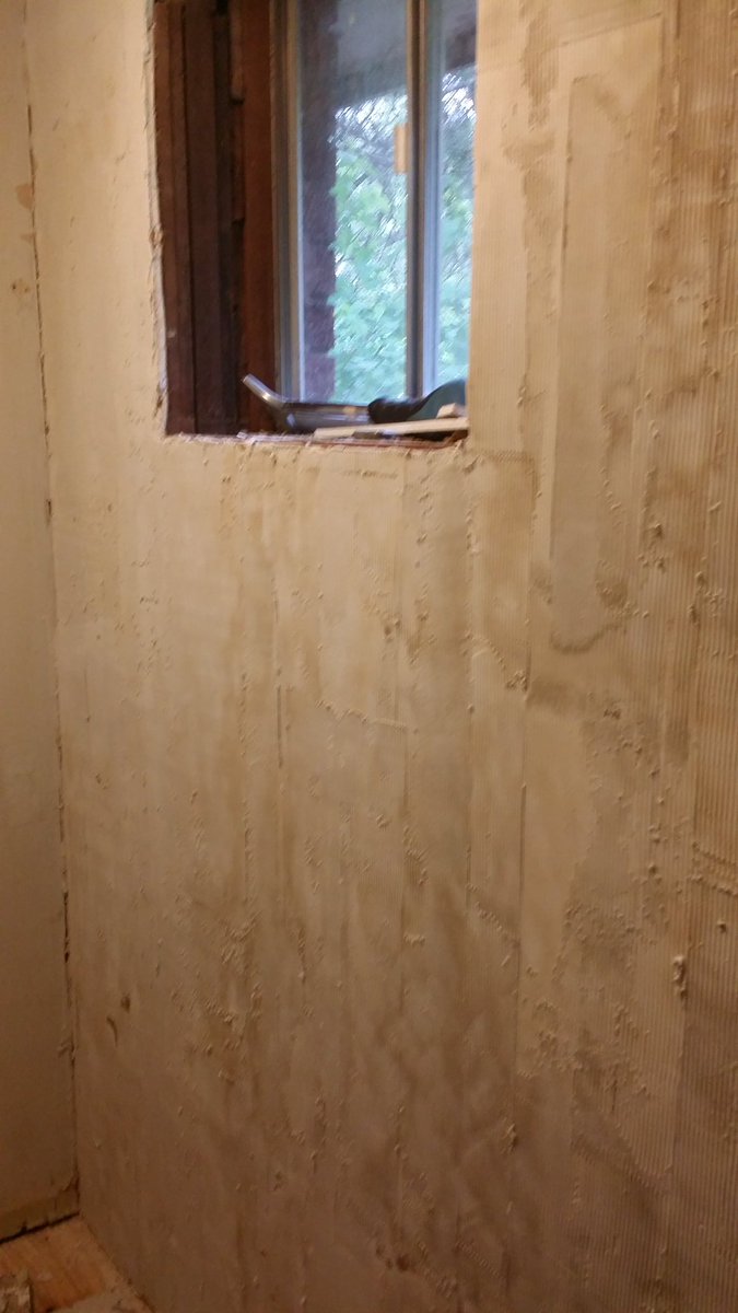 End of the day and the wall has transformed somewhat.No this is not the "normal" method but it is how I was taught by a professional plasterer--not a taper, big difference.The discolouration is caused by the now rough paper covering bleeding through the commpound.