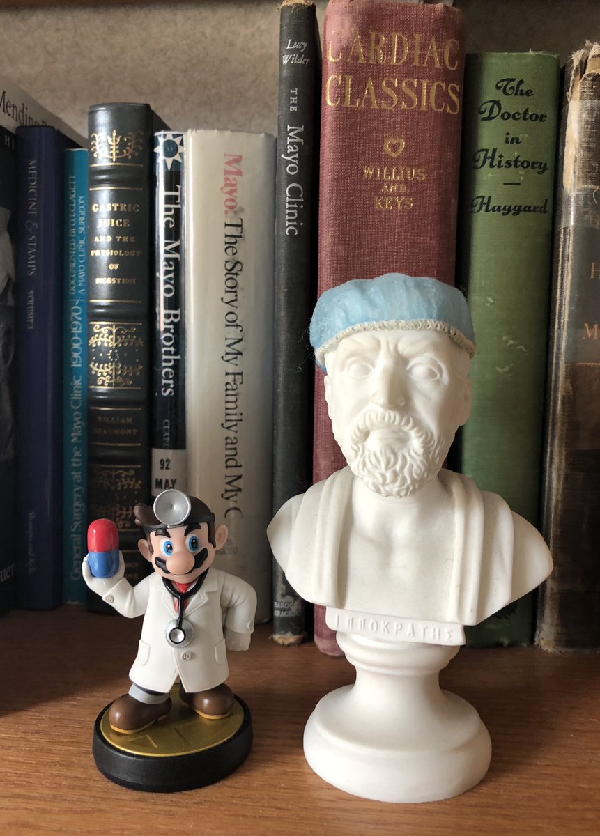DrJamieNewman's tweet photo. Weird things in my office day 6
#WeirdOffice. #HeyMario
#HippocratesIsHip
The two great physicians finally working together 
Dr Mario and Hippocrates (in a surgical cap)
M.B.-Willius-Cardiac Classics in background. The best h/o Cardiology book! https://t.co/MP8DkFUfql