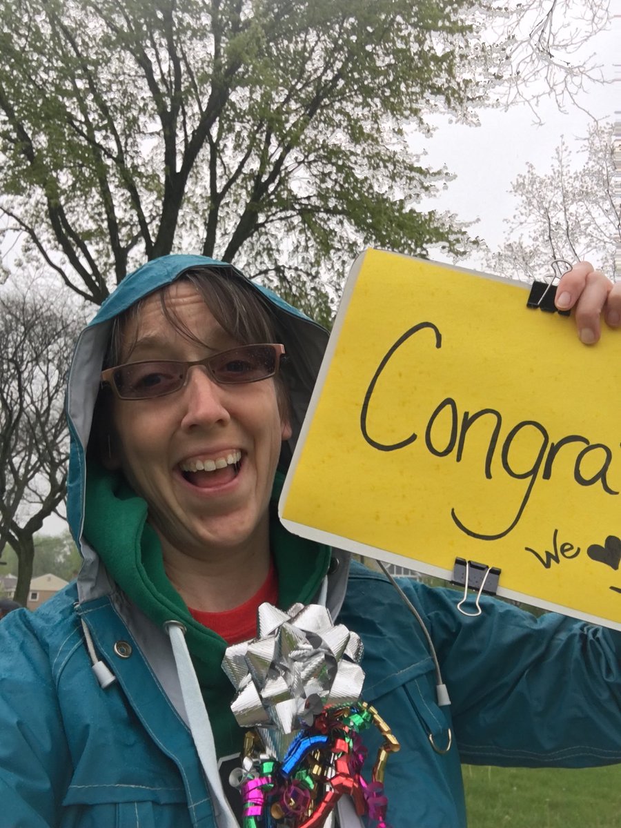 JoyKirr's tweet photo. This is the look of a teacher getting to see some former students yesterday at a non-sanctioned parade in the cold rain. Thankful for the tip-off from a former student and also from a coworker! #HappyTeacher #FacesMatter #GratefulForTheRaincoatInMyTrunk https://t.co/C5KwdviKym