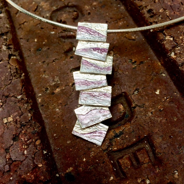 Who knew a Scottish brick would prove so useful?!  Here's a Sheila Fleet flagstone pendant displayed on an old Cadder (Glasgow) brick 🥰 - macgillivrays.co.uk/flagstonependa… - #ukgiftam #ukgifthour #supportsmallbusiness #shopindie #womeninbusiness