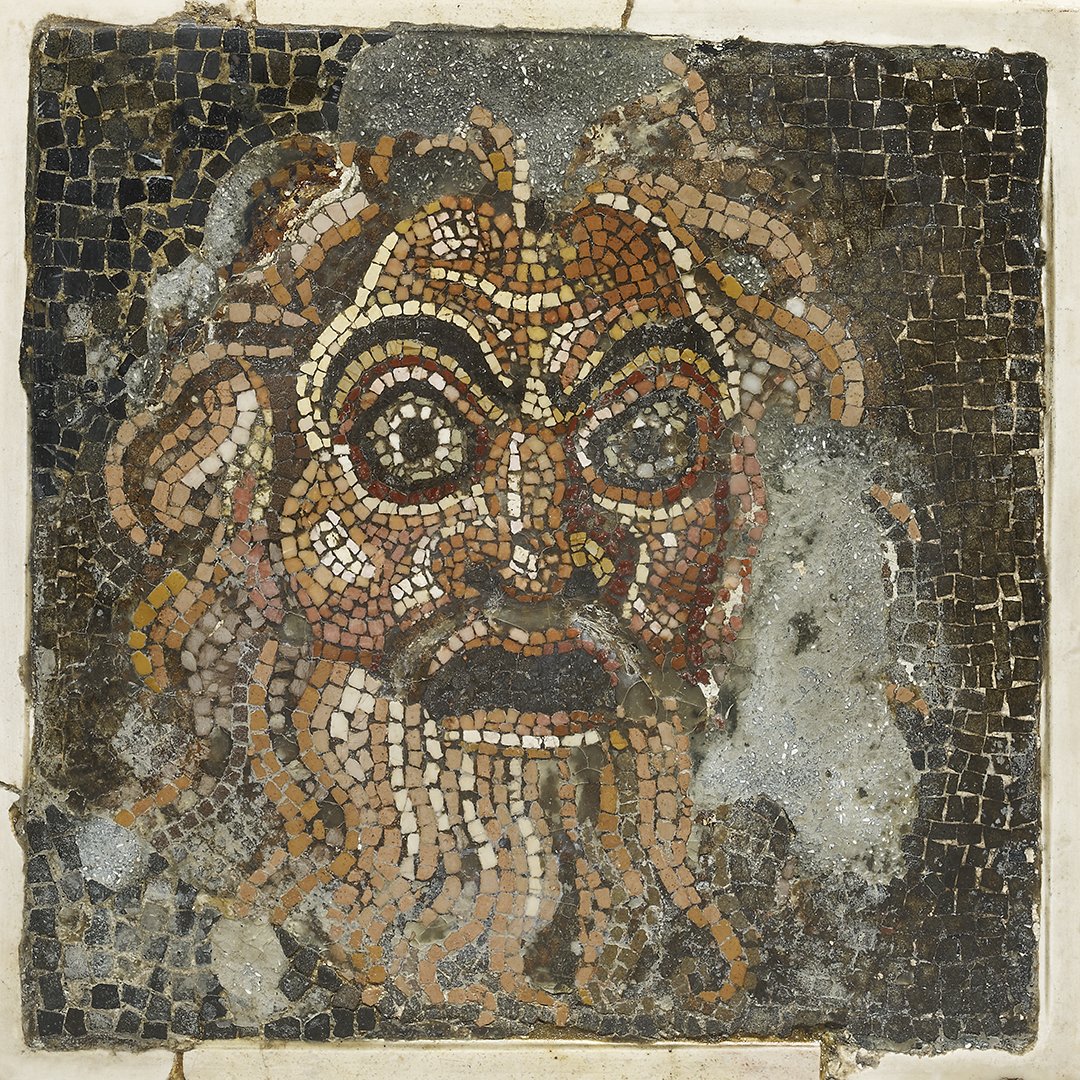 A Roman mosaic showing a theatrical mask.