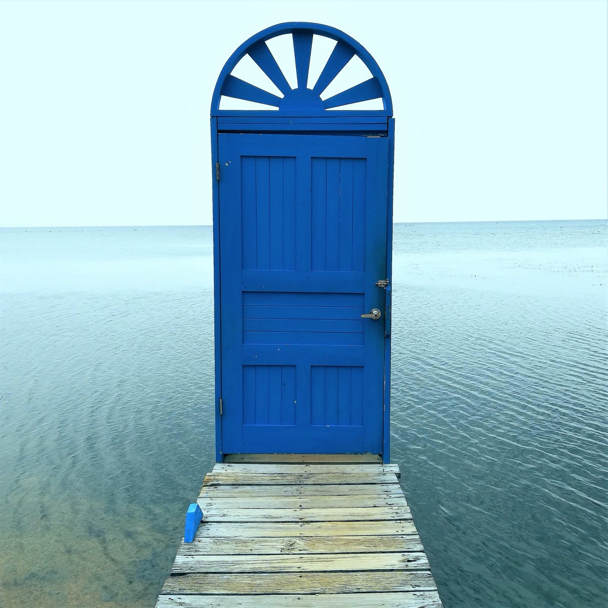 JaniceHorton's tweet photo. ABC Travel: Today I'm on the letter 'R' and I've chosen this quirky photo of blue door at the end of a dock on Roatan. Roatan is the larger of the Bay Islands off Honduras. More pics on my IG: https://t.co/m3rB9HZ06A #Roatan #BayIslands #Honduras #ABCTravel #StayHomeSweetHome https://t.co/w2y0i4IPiY