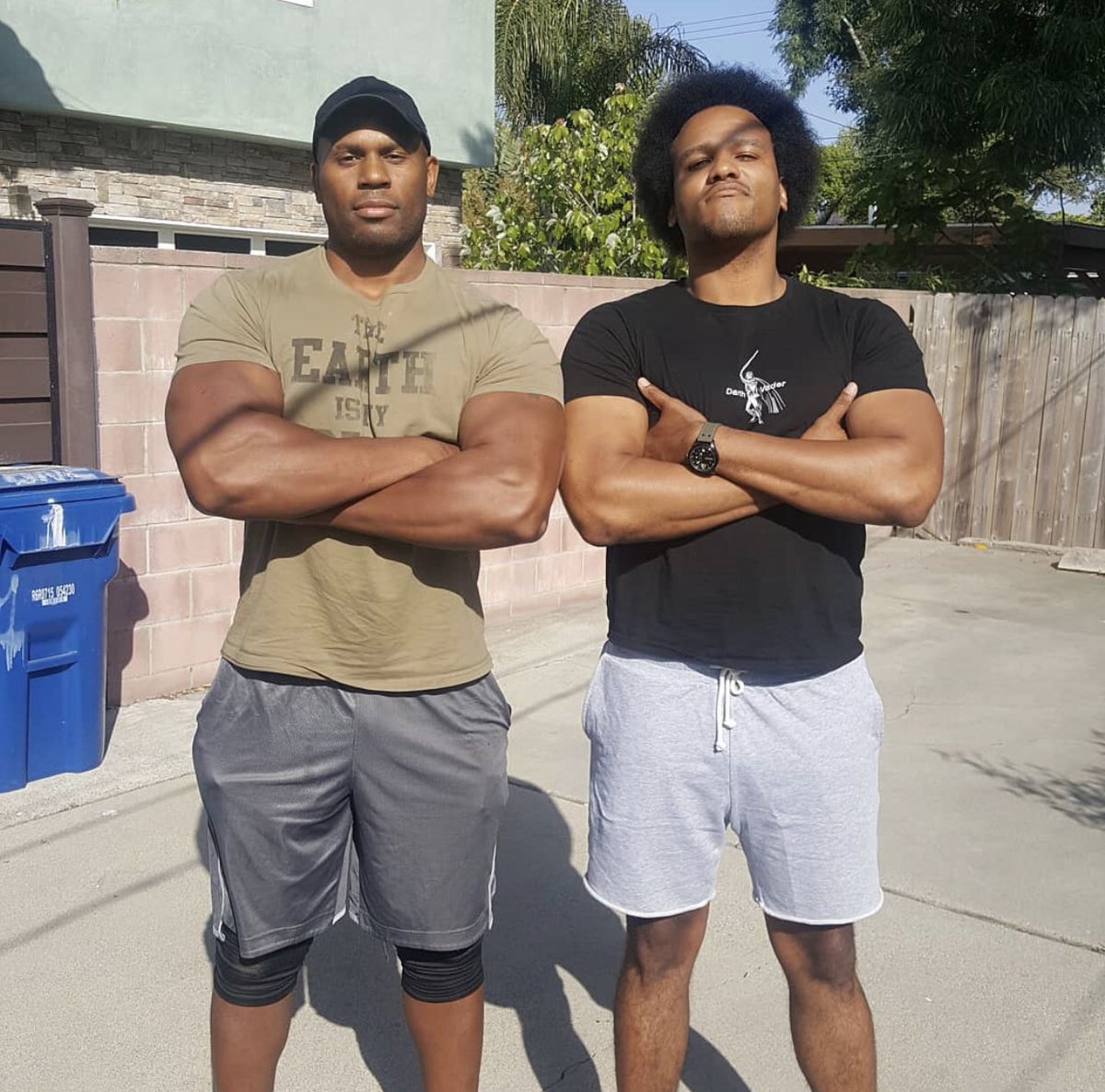 DarthWatts's tweet photo. Here is a pic of me trying to make my arms look bigger by crossing my arms. 

Shad noticed and said “Oh, we’re doing the make your arms bigger thing”.

He then crossed his arms too.
 
I got caught 😂 https://t.co/hE9JI8Qwvx