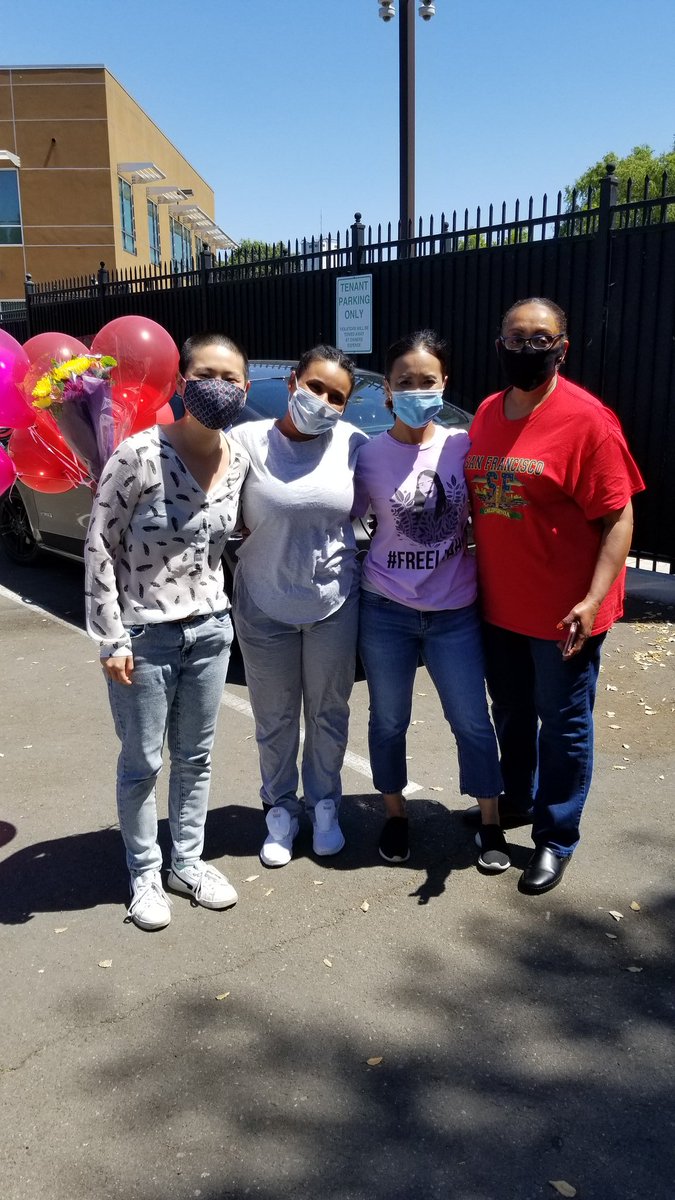 Liyah and #FreeLiyah team happily smile at the camera