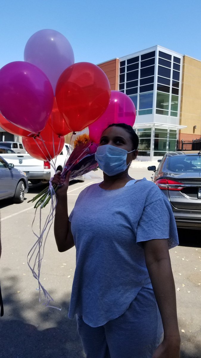 Liyah smiles with balloons!