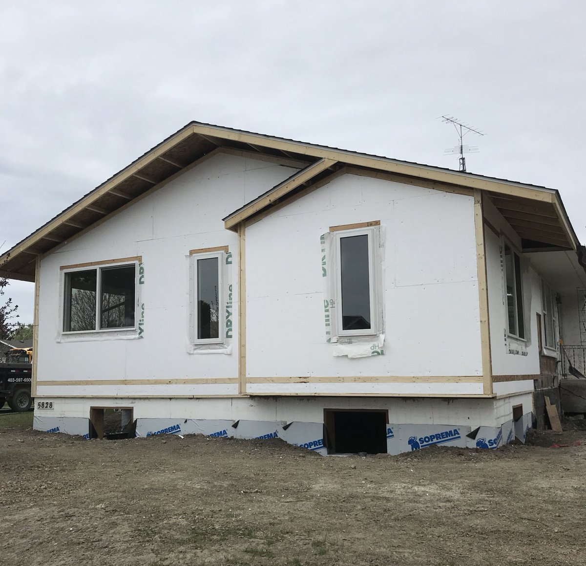 Exterior pics always look better with blue skies but at least we didn’t get wet today like they forecasted! 🌧 We are installing 2” styrofoam from <a href="/SolidICF/">Solid ICF Supply</a> to give this home additional insulation. 
#bullseyecontracting #renovations #construction #lacombe #ponoka