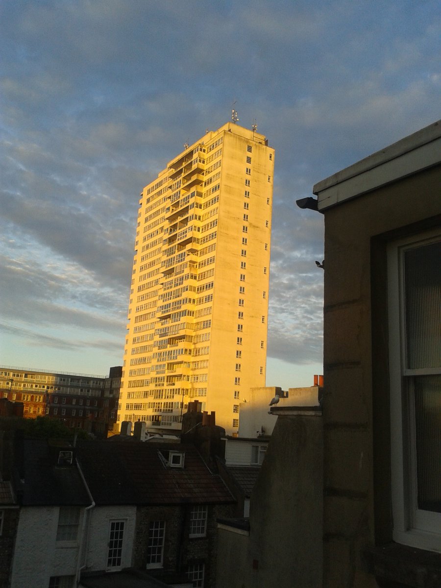 Sparticle6's tweet photo. Here's a view of #SussexHeights, #Brighton at #dawn. The suns golden rays highlighting it in the landscape around! https://t.co/7yPgfcO4ou