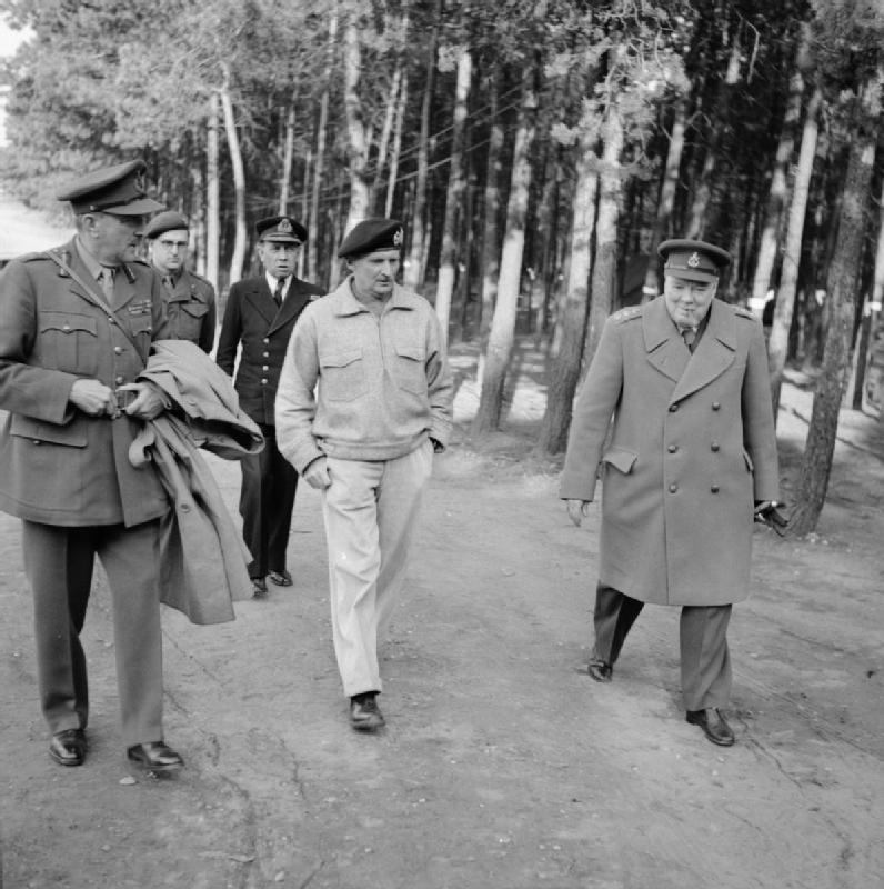 March 1945: Monty well advanced in his "dressing for comfort" phase while Churchill has decided he wants to play soldier today. One feels for the dour Lord Alanbrooke at left.