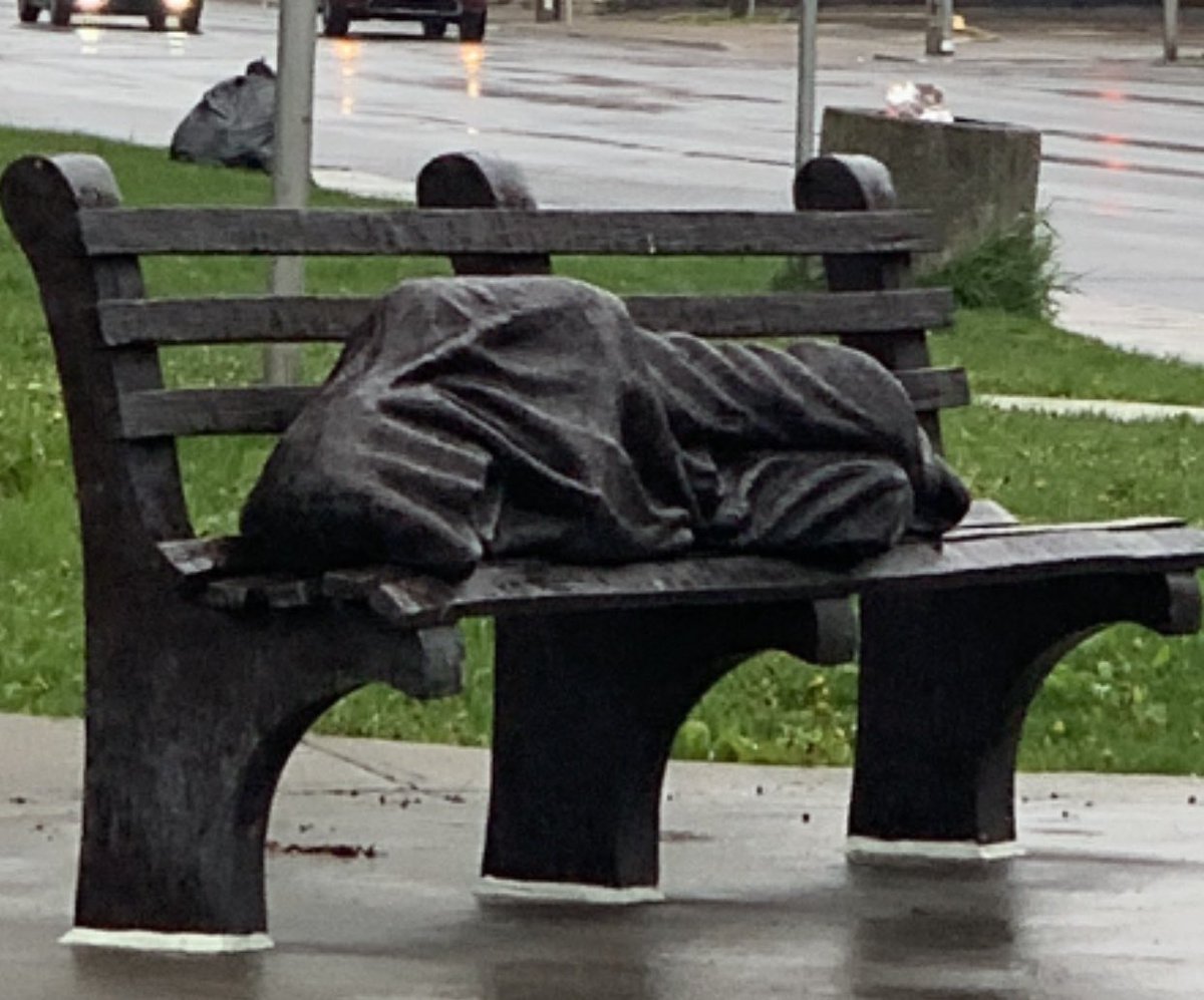 Driving the other day, I saw this, this person has nothing but a wet blanket. The blanket is so wet it looks like the metal of the bench. I would pay to have this recreated into a small metal model, if anyone does that to remind me of what I at times need reminding of. 💔