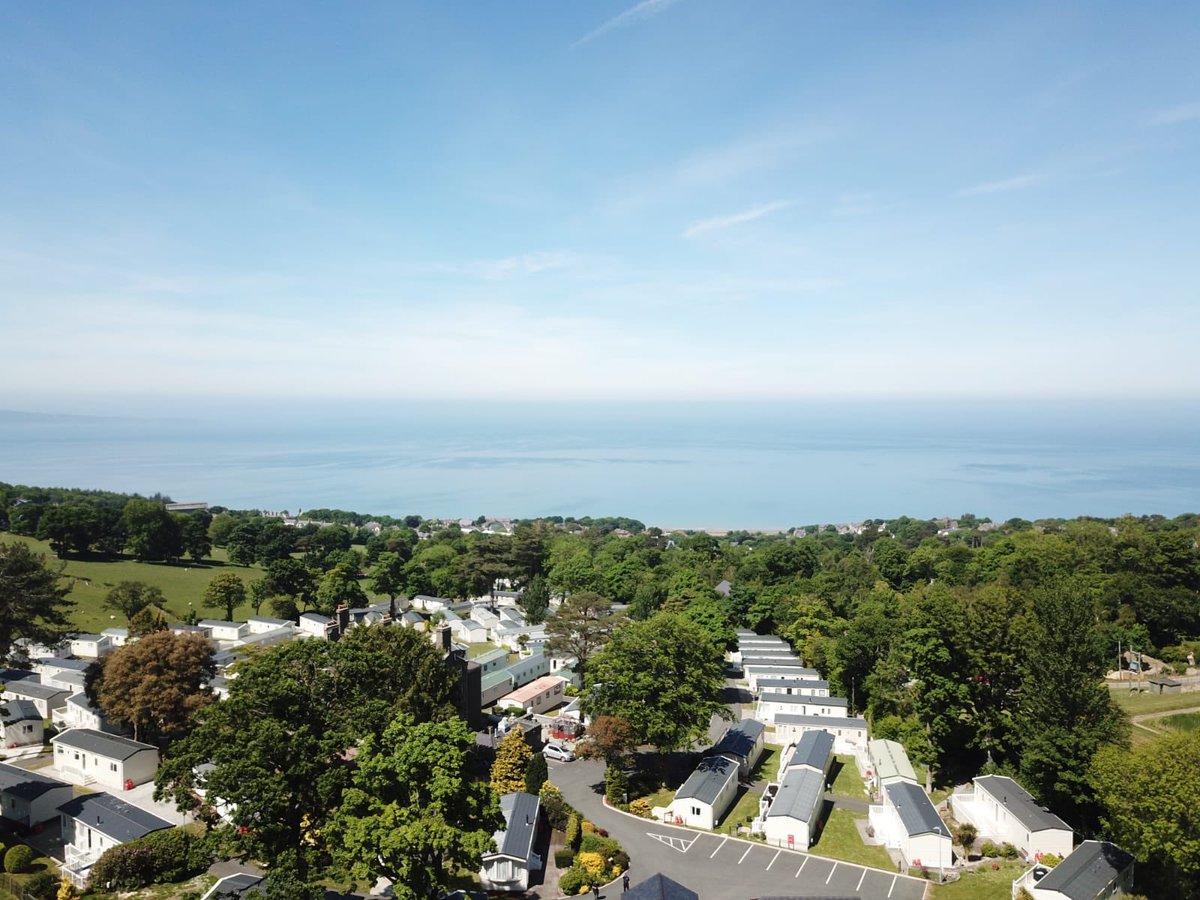 CraiglwydP's tweet photo. Stunning views from the park over to Anglesey and Puffin Island, shame the customers aren’t here to view them. Park is closed but the work to maintain the park continues #StayHome #ProtectOurNHS #SaveLives #ProtectTourismJobs @MarkDrakeford @RobinMillar8 @JFinchSaunders @BHHPA https://t.co/9vrnMko7dW