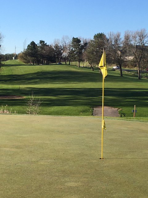 Beautiful early morning shot of #9 Yellow.  The green is covered in dew &amp; awaiting a fresh cut