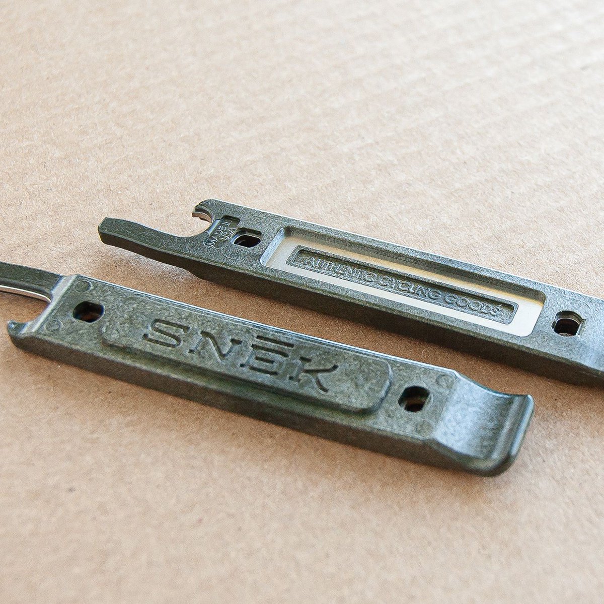 SnekCycling's tweet photo. New colors. Built to last, and guaranteed for life, our Lifeboat Tire Levers are now available in two new colors. Military green and baby blue. Also, get a limited Lifeboat Tee for $10 with the purchase of a lever. Use code: LIFEBOAT at checkout.https://t.co/S2ekt6psFI https://t.co/OaPxT2bmDu