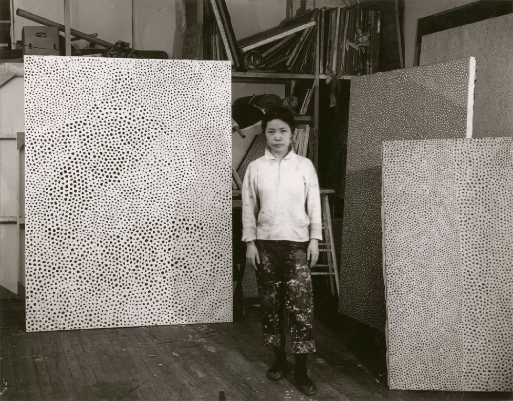 Kusama began creating net-like paintings in 1959. She painted the very large-scale paintings sometimes all in white and other times in a variety of other color combinations.[Rudy Burckhardt, “Yayoi Kusama in her studio.,” c. 1960, NGA Library]