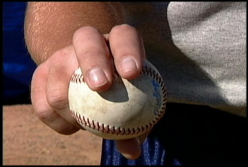 4 SEAM FASTBALLAlso called "heat" or "heater".It's the most basic pitch in baseball, the first pitch every kid learns to throw. It's typically the fastest pitch in one's repertoire.It gets its name from the way it rotates in the air, with backspin.Here's the grip:
