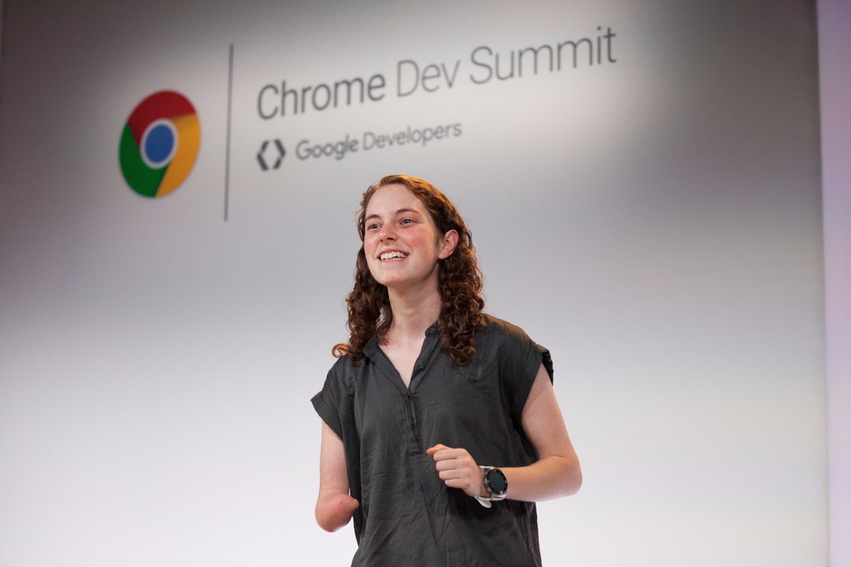 Tal excitedly standing in front of "Chrome Dev Summit" backdrop