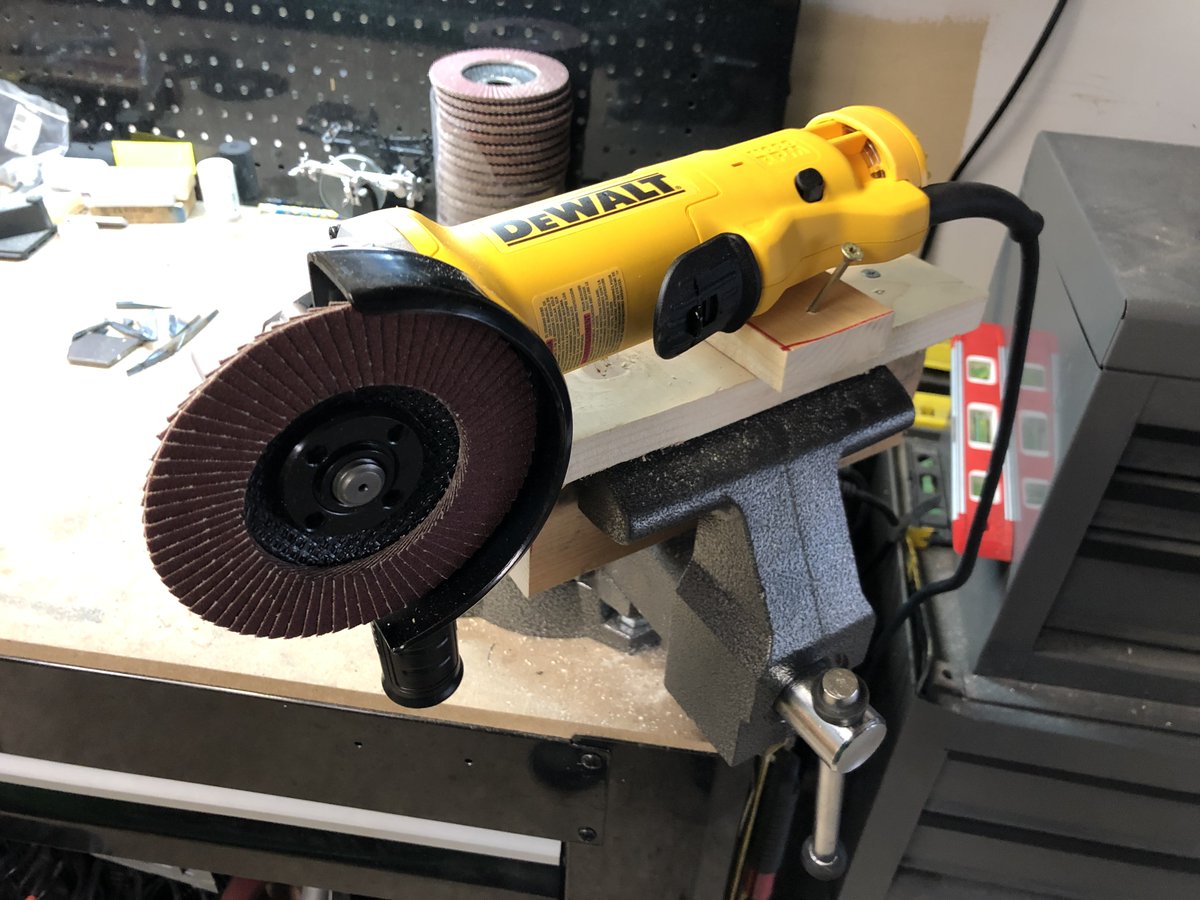 I built a contraption to hold the grinder on its side so I could work on the profiling and then attached a sanding wheel.