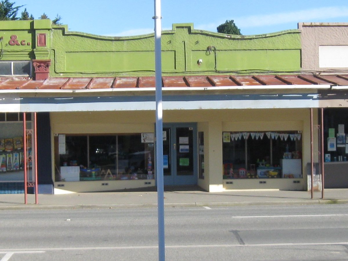 Another in Otautau Main St photodocumentary series pre & post Covid: 1. Originally home to many local businesses, including MO McIvor & H Laing Baker as shown, c1930s CC 0; 2. VetSouth Otautau premises for a time, taken 2016, CC BY; 3 & 4. Otautau Toy Library in May 2020, CC BY.