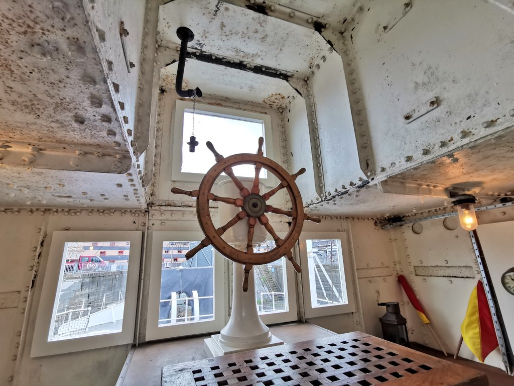 The distinctive wheelhouse has a raised platform for the helmsman to see over the forward gun position.Note the voice pipe allowing commands to be passed down from the navigation bridge above when used.