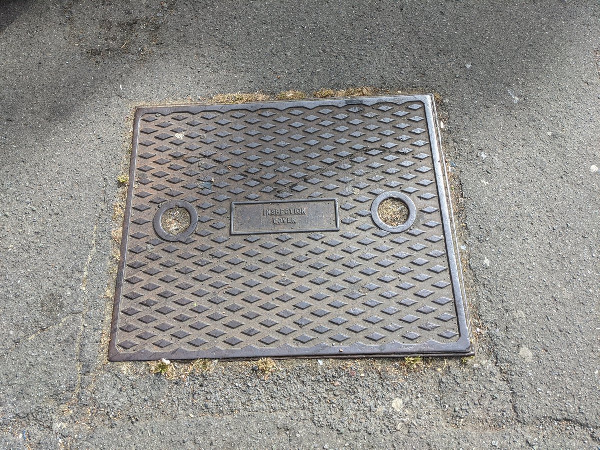 This is arguably the iconic UK manhole design. But you don't see it much these days.Someone once told me they were tricky to lift.