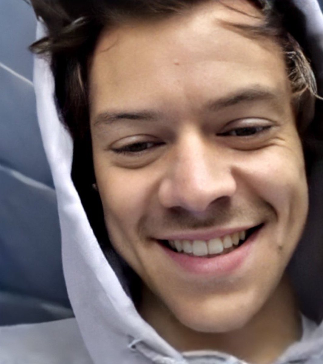 Harry Styles smiling but his smile keeps getting bigger as you scroll down.