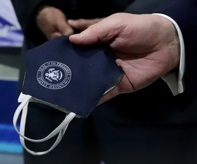 Donald Trump apparently doesn’t want his  #maga supporters to see him wearing a mask. But he did wear one yesterday, and it had the presidential seal.  https://www.theguardian.com/us-news/2020/may/22/pictures-show-donald-trump-wearing-mask-after-ford-factory-row