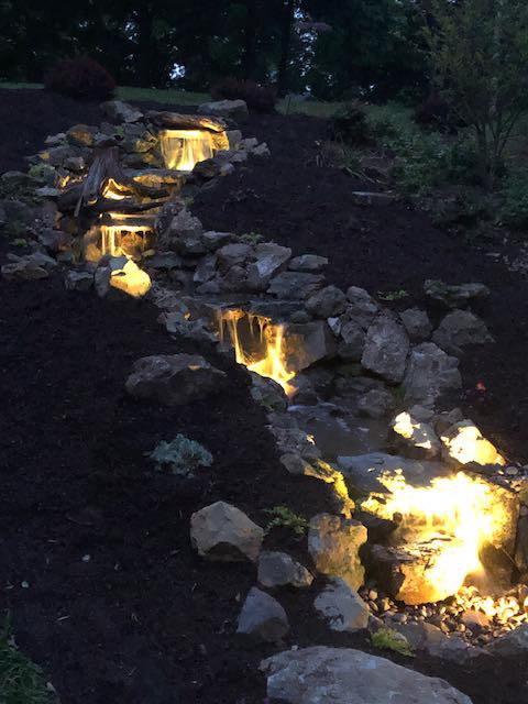We finished our Aquascape Pondless waterfall project. Here are some photos. Happy Homeowners!