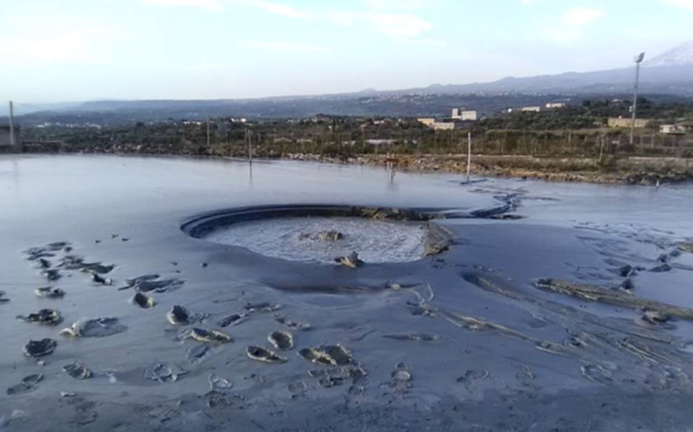 There are quite a few nice ground photos of the Paternò mud volcano, and it is reported that the main vent area is always quite active and bubbling away – though not easily accessible due to the soft mud.Photo by Guido Ella Latina from Google Earth.