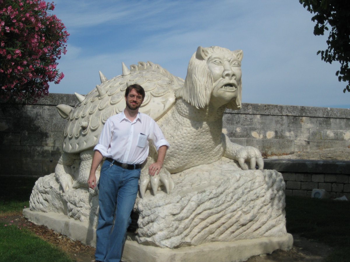 A much younger Chris hangin' with the Tarrasque (a modern statue, but reflecting an annual parade-float monster still in use and going back to the late medieval/early modern period - sadly I was not there on parade day)