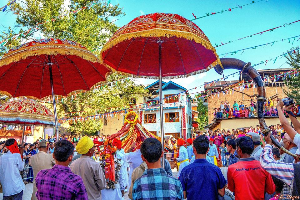 On the day of the festivities The Patt, a tall heavy load of conical shape with the urn on the top and decorated with beautiful flowers and hundreds of colourful pieces of cloth (symbolic of the velvet robes rewarded by Emperor Akbar) is carried through the town