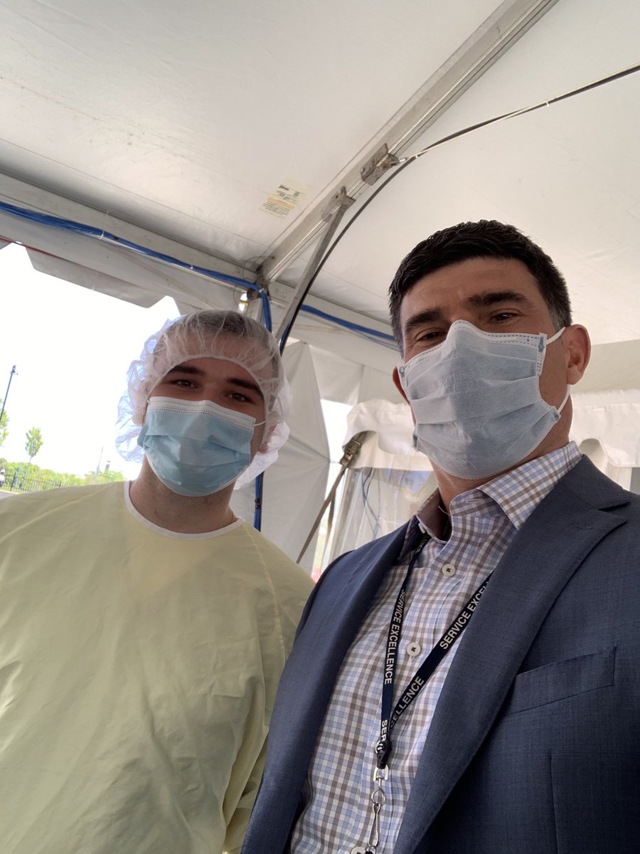 Dr. Garrett Bomba, ‘92 and Andrew DeMinico ‘19 working the front lines at the newly established Covid  19 testing tent in Lawrence!